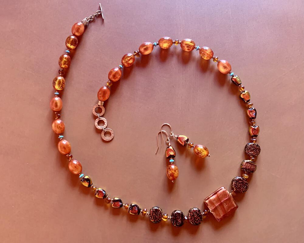 Necklace set | Sunset hues, Rufino Oro Italian rose gold focal bead, fiery orange red dichroic glass, vintage Lucite, amber, turquoise