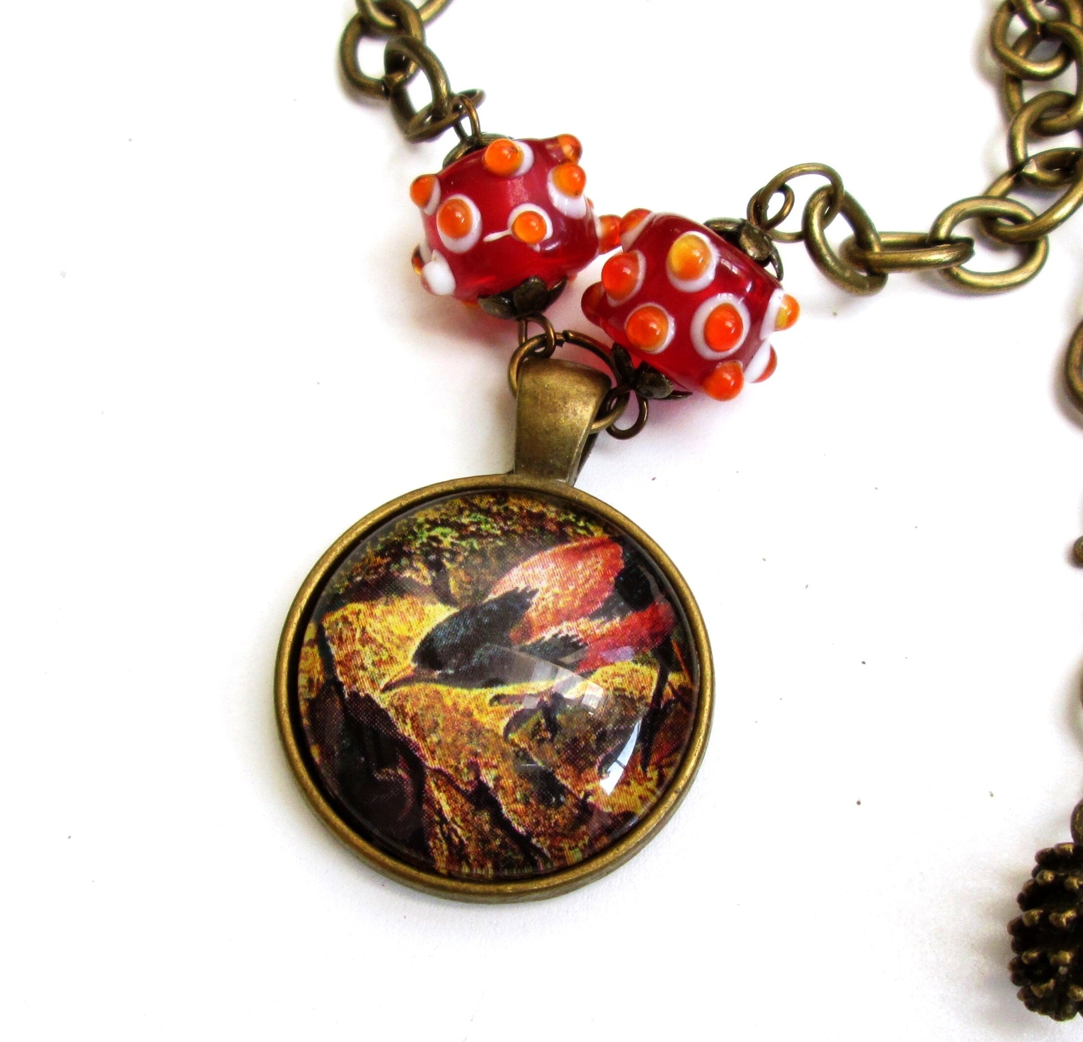Colorful altered art bird pendant necklace for Fall, vintage style art pendant, vintage bird art necklace, pine cone charm, red and yellow